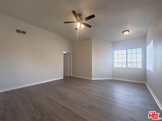 unfurnished room featuring ceiling fan, lofted ceiling, and dark wood-type flooring