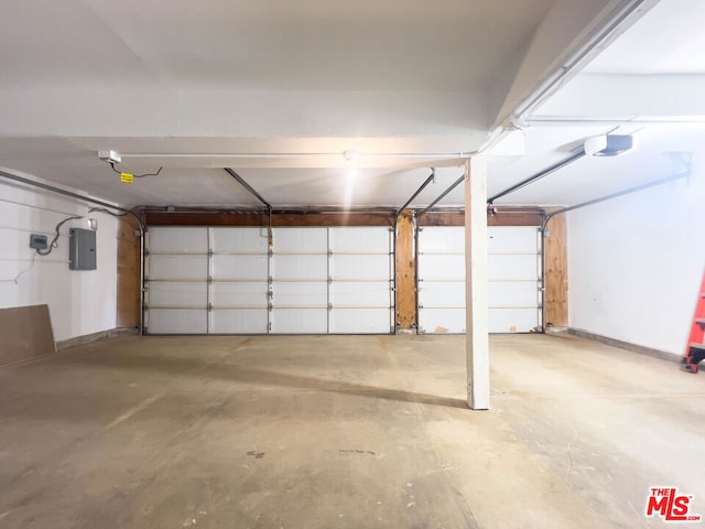 garage featuring a garage door opener and electric panel