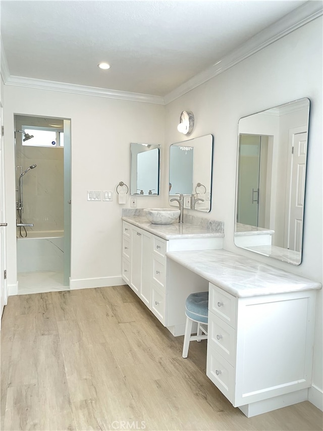 bathroom featuring washtub / shower combination, wood-type flooring, vanity, and crown molding