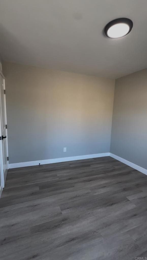 empty room featuring dark hardwood / wood-style floors