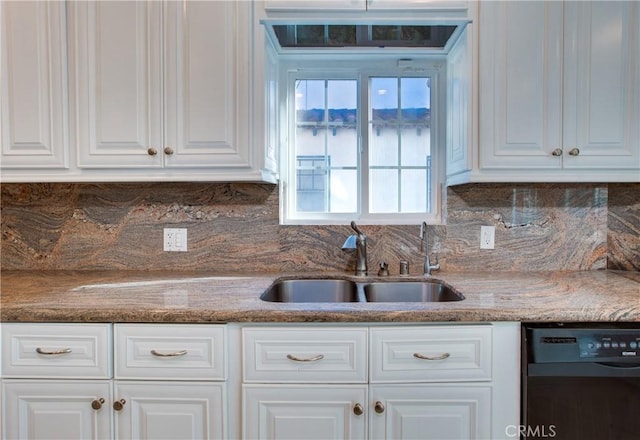 kitchen featuring decorative backsplash, sink, white cabinetry, and black dishwasher