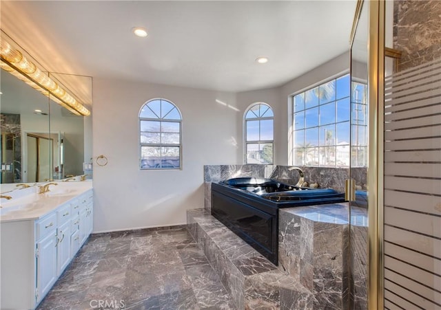 bathroom featuring vanity and a bathing tub