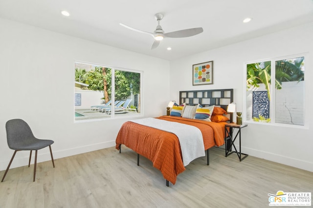 bedroom with ceiling fan and light hardwood / wood-style flooring