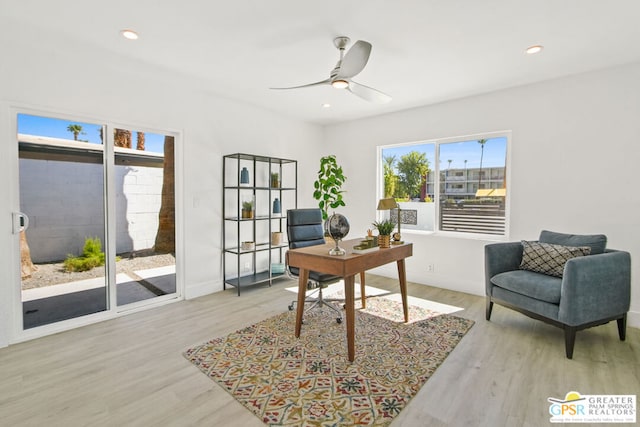 office with ceiling fan and light wood-type flooring