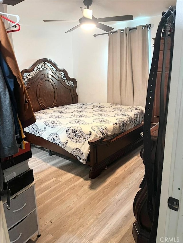 bedroom featuring ceiling fan and light wood-type flooring