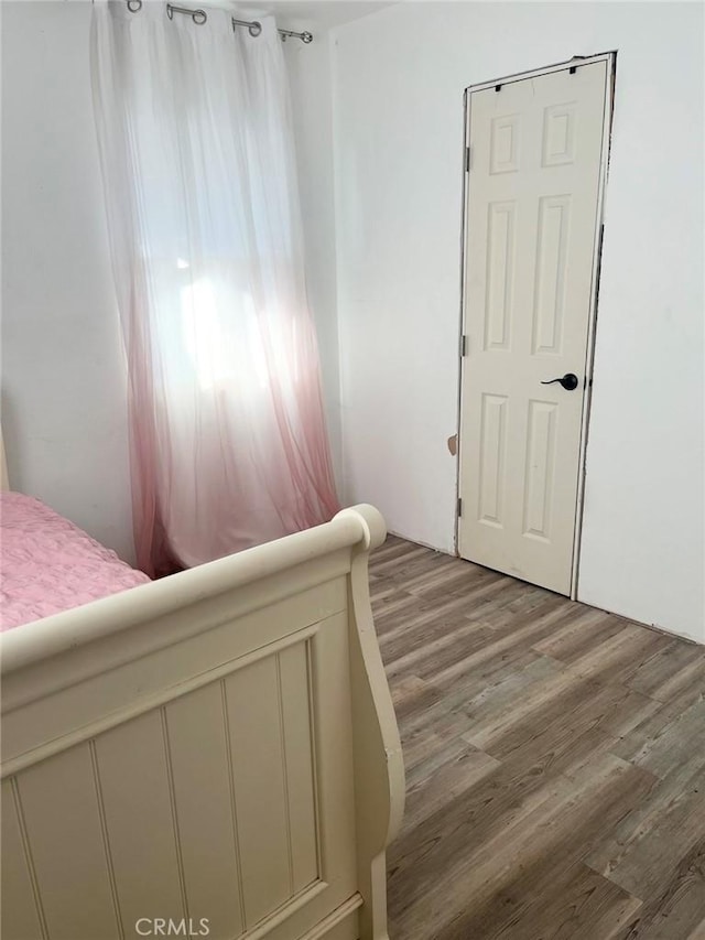 bedroom with light hardwood / wood-style flooring