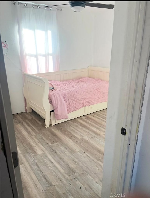 bedroom with light hardwood / wood-style floors