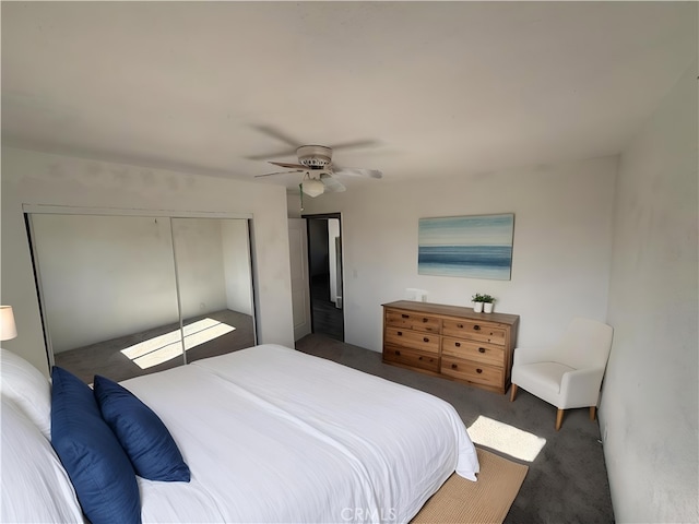 bedroom with ceiling fan, a closet, and dark carpet