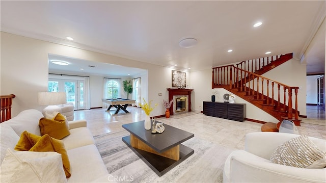 living room featuring french doors, ornamental molding, and pool table