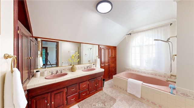 bathroom with vanity, separate shower and tub, and lofted ceiling