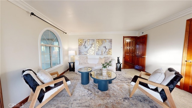 sitting room with crown molding and light carpet