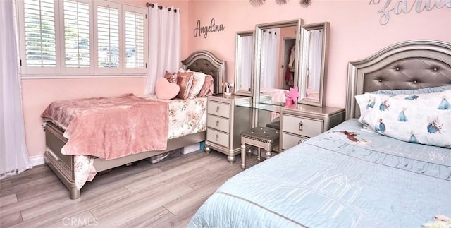 bedroom with light wood-type flooring