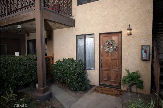 entrance to property with a balcony