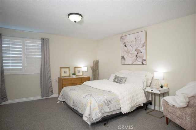 carpeted bedroom with a textured ceiling