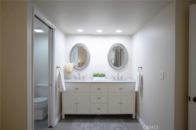 bathroom with vanity and toilet