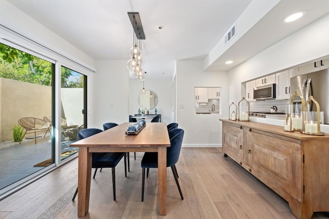 dining space featuring light hardwood / wood-style flooring