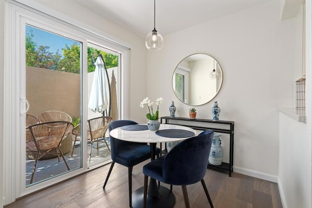 dining room with dark hardwood / wood-style floors