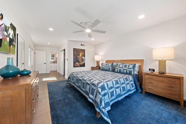 bedroom featuring ceiling fan and dark hardwood / wood-style flooring