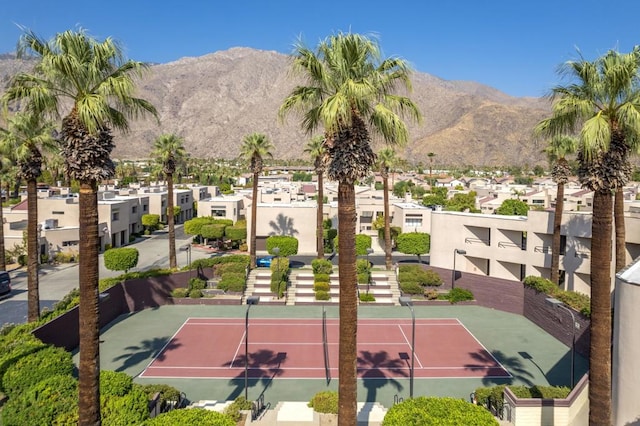 view of sport court with a mountain view