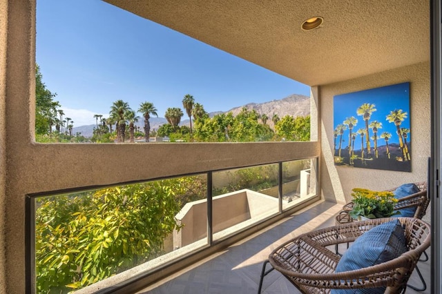 balcony featuring a mountain view