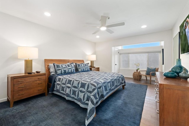 bedroom with ceiling fan and dark wood-type flooring