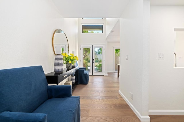 entrance foyer with hardwood / wood-style flooring and french doors