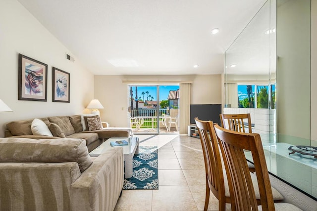 living room featuring a healthy amount of sunlight and light tile patterned floors