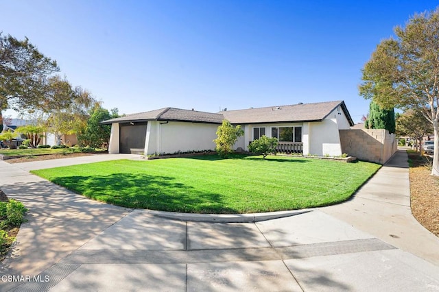 view of front of house with a front lawn and a garage