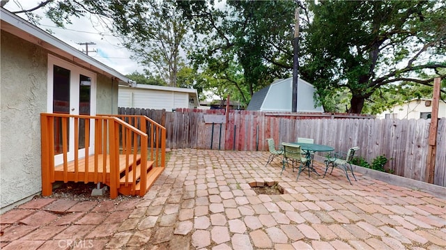 view of patio / terrace with outdoor dining space and a fenced backyard