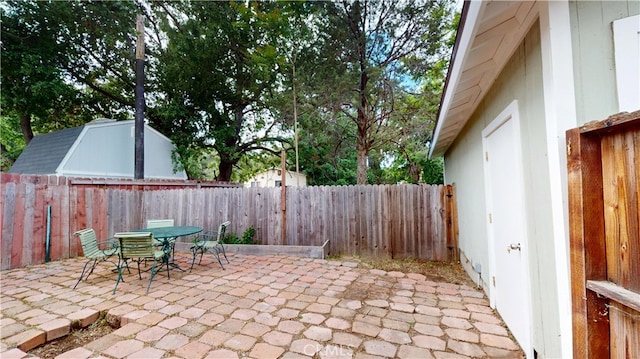 view of patio / terrace with outdoor dining area and a fenced backyard