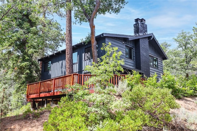 back of house featuring a deck