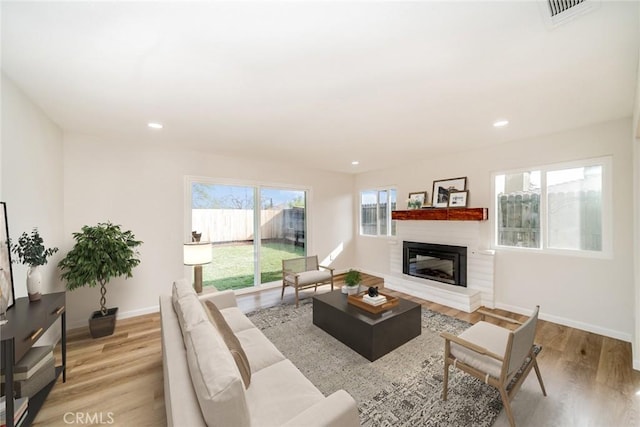 living room with light hardwood / wood-style floors