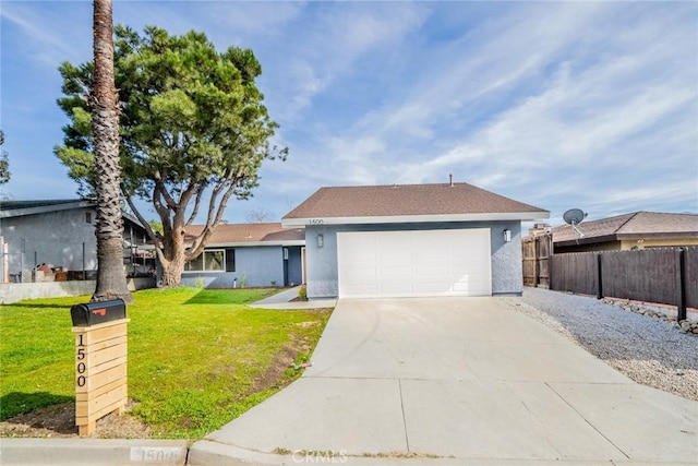 ranch-style house featuring a front yard and a garage