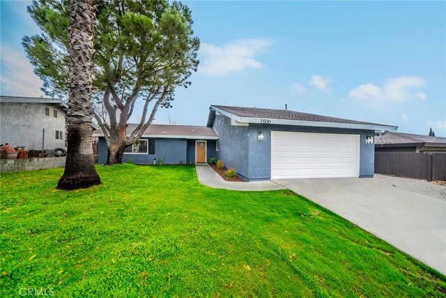 single story home with a front yard and a garage