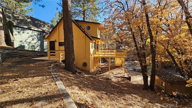 view of side of home featuring a deck