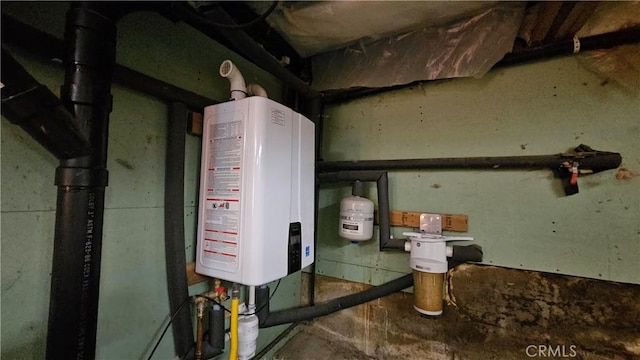 utility room featuring tankless water heater