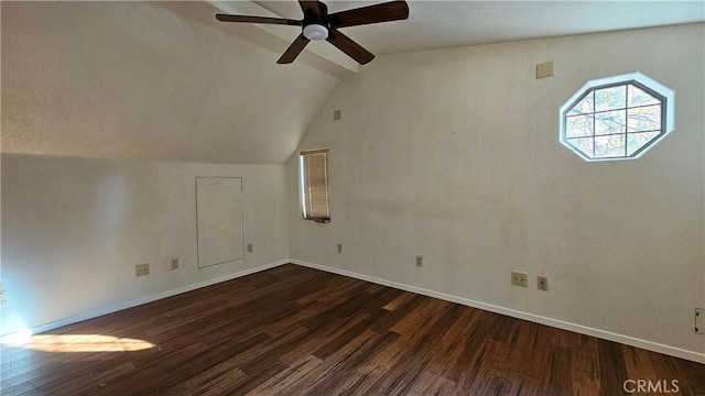 additional living space with dark hardwood / wood-style flooring, vaulted ceiling, and ceiling fan