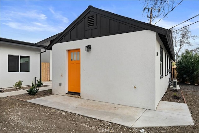 back of property featuring central air condition unit