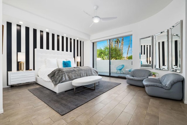 bedroom featuring light wood-type flooring, access to outside, and ceiling fan