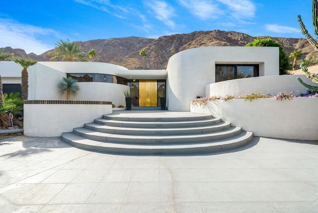 view of front of house with a mountain view