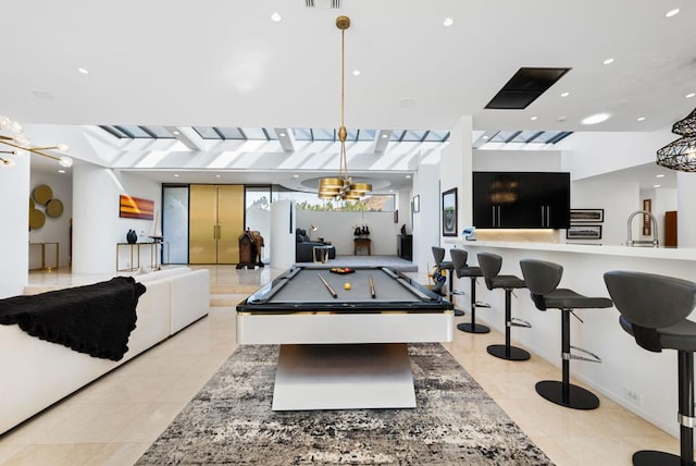 playroom with light tile patterned floors, sink, and pool table