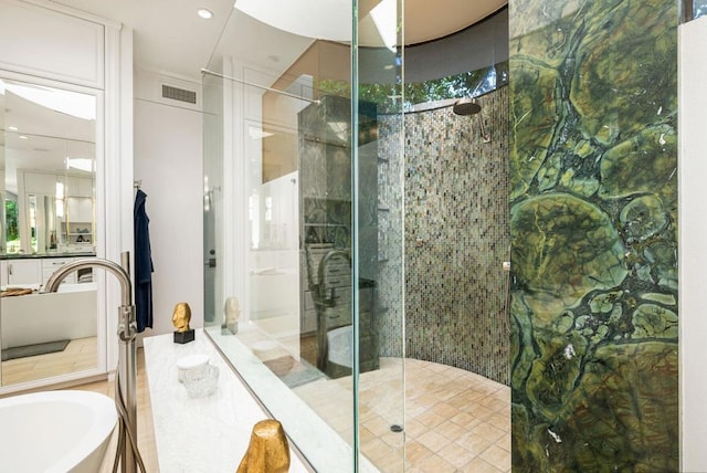 bathroom with separate shower and tub and a wealth of natural light