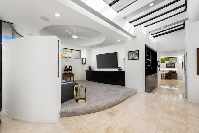 tiled living room with ceiling fan