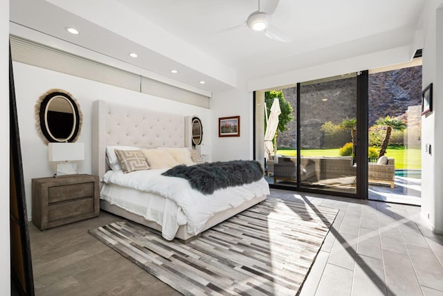 bedroom featuring access to exterior, light tile patterned floors, and ceiling fan