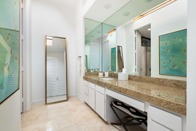 bathroom featuring tile patterned floors and vanity