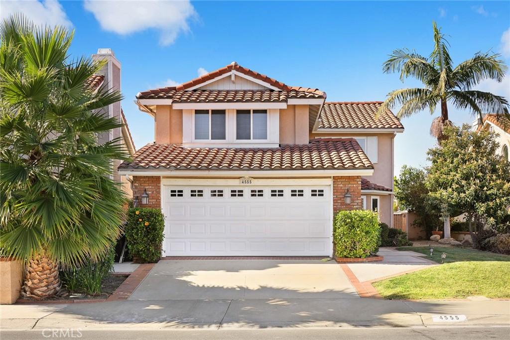 mediterranean / spanish home featuring a garage