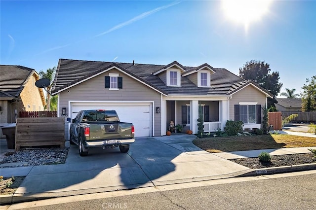 view of front of house featuring a porch and a garage