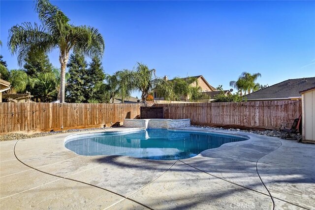 view of swimming pool featuring a patio area