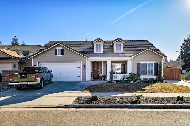 view of front of property featuring a garage and covered porch