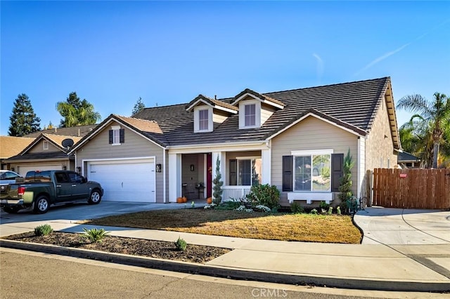 view of front of property featuring a porch and a garage